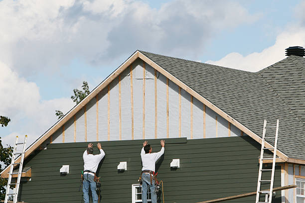 Professional Vinyl Siding technician working in Brighton, MA